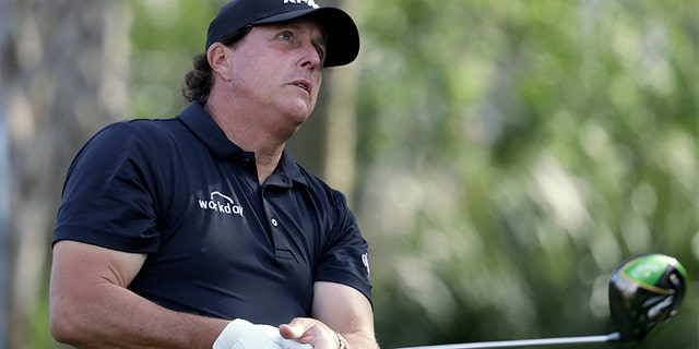 Phil Mickelson watches his tee shot on the 13th hole during the first round of The Players Championship golf tournament Thursday, March 14, 2019, in Ponte Vedra Beach, Fla. (AP Photo/Lynne Sladky)