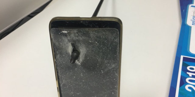 An Australian man was able to block an arrow from hitting him after his phone become a shield, police said.