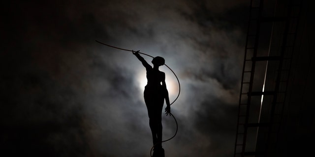 A sculpture cuts out on the full moon in Brussels, Wednesday 20 March 2019. (AP Photo / Francisco Seco)