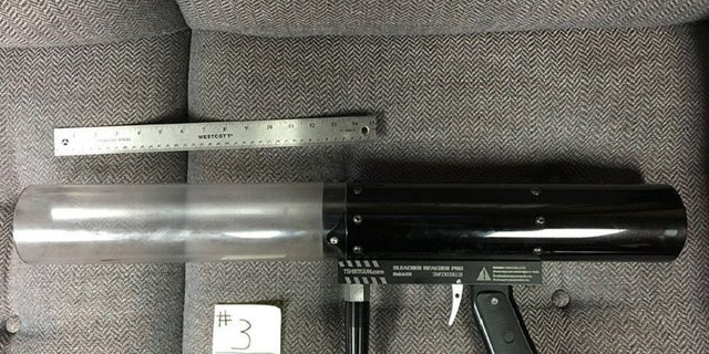 A T-shirt gun was used to shoot contraband over a prison fence, Oklahoma corrections official said.