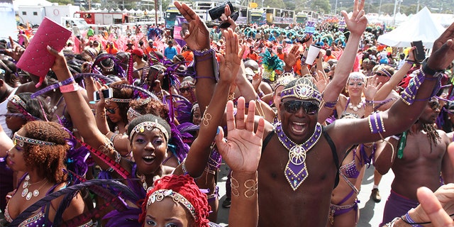 PORT OF SPAIN, TRINIDAD - FEBRUARY 17: Masqueraders from the band Fantasy Carnival perform in the Queen's Park Savannah during the Parade of Bands as part of Trinidad and Tobago Carnival on February 17, 2015 in Port of Spain, Trinidad. (Photo by Sean Drakes/LatinContent/Getty Images)