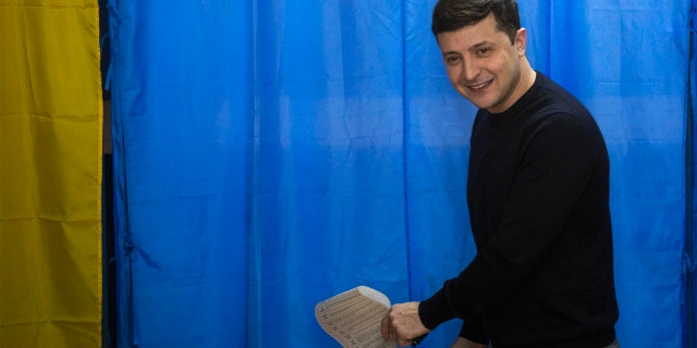 Ukrainian comedian and presidential candidate Volodymyr Zelenskiy holding his ballot before voting in the presidential elections in Kiev, Ukraine, on Sunday. (AP Photo/Emilio Morenatti)