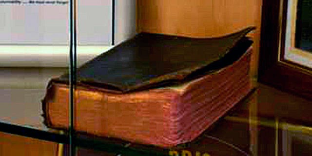 A Bible donated by a World War II veteran on display in a Manchester VA Medical Center memorial is being targeted by the Military Religious Freedom Foundation.