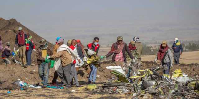 Rescuers work at the scene of an Ethiopian Airlines flight crash near Bishoftu, or Debre Zeit, south of Addis Ababa, Ethiopia, last Monday.