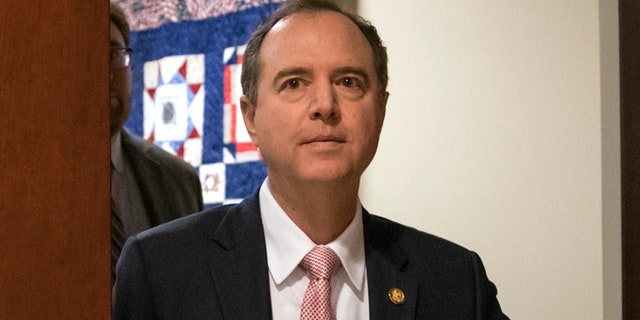 FILE - In this March 22, 2018 photo, Rep. Adam Schiff, D-Calif., then ranking member of the House Intelligence Committee, exits a secure area to speak to reporters, on Capitol Hill in Washington. (AP Photo/J. Scott Applewhite)