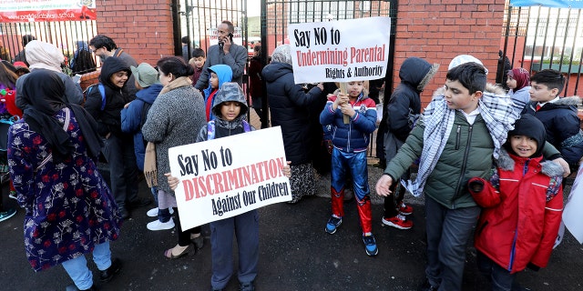 The organizers accused gay assistant head Andrew Moffatt of promoting LGBT rights against the wishes of the parents, who carried placards reading “Say no to sexualizing children” and “respect and be respected.”