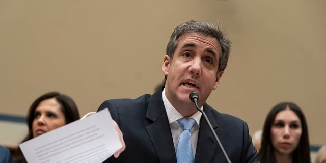 Michael Cohen, President Donald Trump's former personal lawyer, reads an opening statement as he testifies before the House Oversight and Reform Committee on Capitol Hill in Washington. Cohen will be released from prison early due to the coronavirus pandemic, a source familiar with the case told Fox News late Thursday. (AP Photo/J. Scott Applewhite, File)