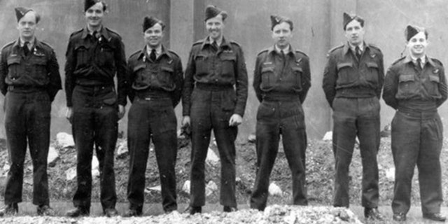 Blackham, center, and members of his squadron in WWII.