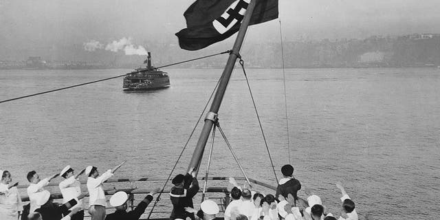 Flagship ceremony on Bremen in the port of New York. After the Reichsflaggengesetz adopted by the Reichstag, the German merchant flag was replaced by the Nazi flag. Photo by ullsteinbild via Getty Images)