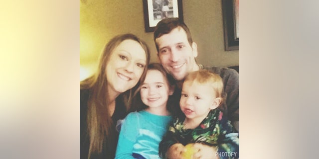 The couple, pictured with their two children, said they told the kids that they were both sick, but avoided using the word cancer.