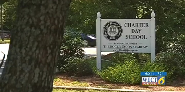 Students run outside of school as Charter Day dress code was recently deemed unconstitutional