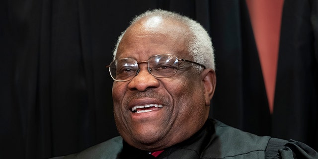 Associate Justice Clarence Thomas, appointed by President George H. W. Bush, sits with fellow Supreme Court justices for a group portrait at the Supreme Court Building in Washington, Friday, Nov. 30, 2018. Thomas Monday wrote that Obergefell v. Hodges, the ruling that mandates all states recognize same-sex marriages, is "found nowhere in the text" of the Constitution. (AP Photo/J. Scott Applewhite)