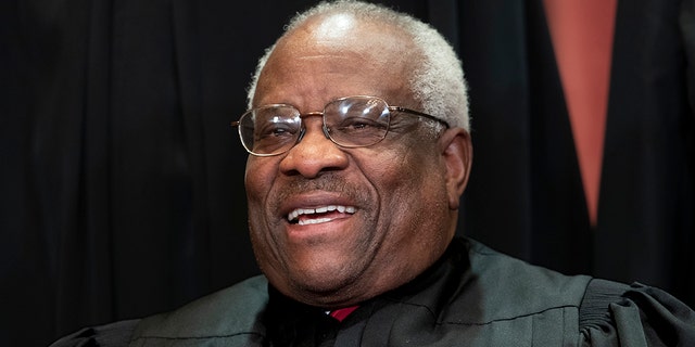 Associate Justice Clarence Thomas, appointed by President George H. W. Bush, sits with fellow Supreme Court justices for a group portrait at the Supreme Court Building in Washington, Friday, Nov. 30, 2018. Thomas Monday wrote that Obergefell v. Hodges, the ruling that mandates all states recognize same-sex marriages, is "found nowhere in the text" of the Constitution. (AP Photo/J. Scott Applewhite)