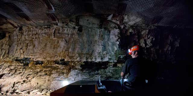 A worker drives a car on a guided tour of the Portal 31 coal mine, which has been turned into a tourist attraction in Lynch, Kentucky. (AP Photo / David Goldman)