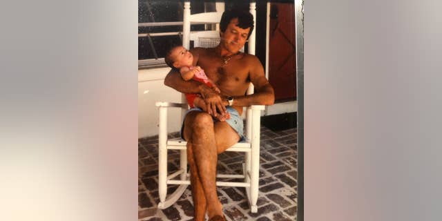 Brady Cobb as a baby with father, Bill Cobb