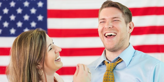 Millennials say date's political views are more important than sex, study reports Couple-laughing-american-flag-istock