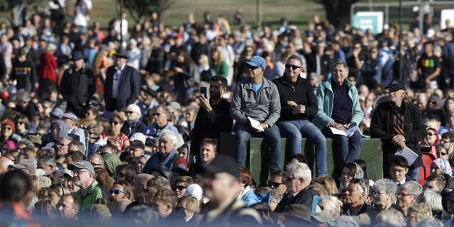 People listen during a National Remembrance Service in Hagley Park for the victims of the March 15 mosques terrorist attack in Christchurch, New Zealand, Friday, March 29, 2019.