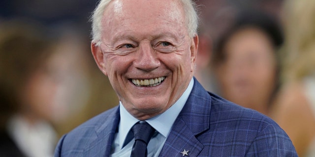 Dallas Cowboys owner Jerry Jones smiles before the team's NFL football game against the Houston Texans in Houston. 