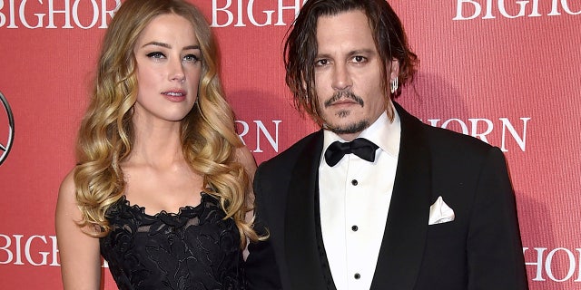 Amber Heard, left, and Johnny Depp arrive at the 27th annual Palm Springs International Film Festival Awards Gala in Palm Springs, California. 