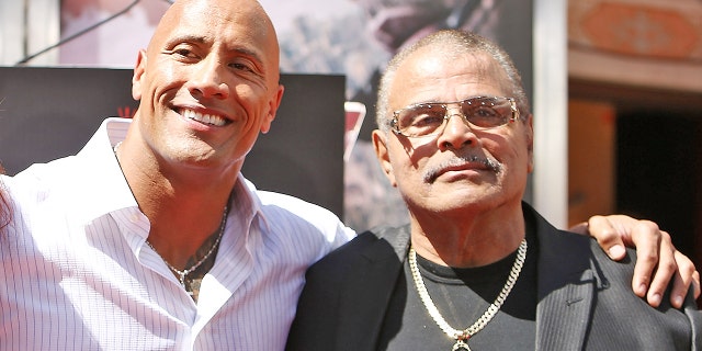 Dwayne "The Rock" Johnson and his father, Rocky Johnson