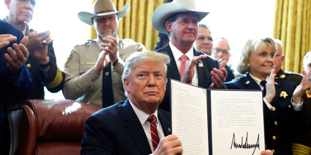 President Donald Trump speaks about border security in the Oval Office of the White House, Friday, March 15, 2019, in Washington. Trump issued the first veto of his presidency, overruling Congress to protect his emergency declaration for border wall funding. (AP Photo/Evan Vucci)