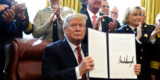 President Donald Trump speaks about border security in the Oval Office of the White House, Friday, March 15, 2019, in Washington. Trump issued the first veto of his presidency, overruling Congress to protect his emergency declaration for border wall funding. (AP Photo/Evan Vucci)