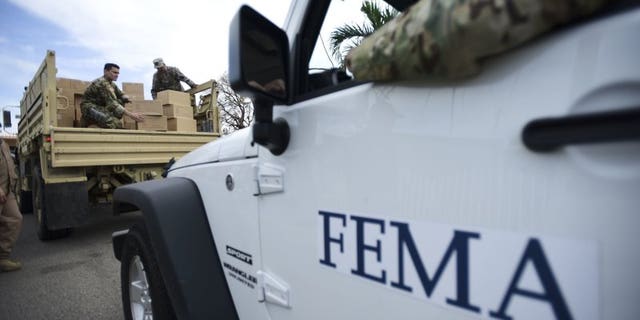 Federal Emergency Management Agency personnel deliver supplies in the aftermath of Hurricane Maria in Guayama, Puerto Rico, on Oct. 5, 2017.