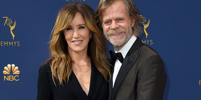 In this Sept. 17, 2018 file photo, Felicity Huffman, left, and William H. Macy arrive at the 70th Primetime Emmy Awards in Los Angeles.