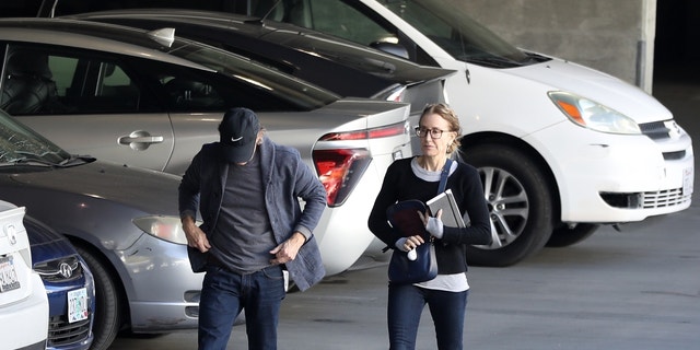 Felicity Huffman and William H.Macy walking back to the Federal courthouse in Los Angeles on Friday.