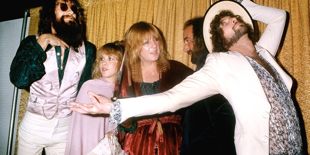 Fleetwood Mac (L-R Mick Fleetwood, Stevie Nicks, Christine McVie, John McVie and Lindsey Buckingham) pose for photographers backstage at the 5th American music Awards held at the Santa Monica Civic Auditorium on January 16, 1978 in Santa Monica, California.