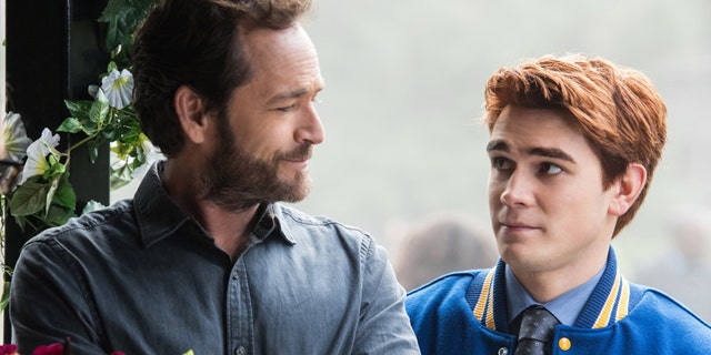 Luke Perry, left, pictured here as Fred Andrews, with his on-screen son, Archie Andrews, right, portrayed by KJ Apa on The CW's "Riverdale."