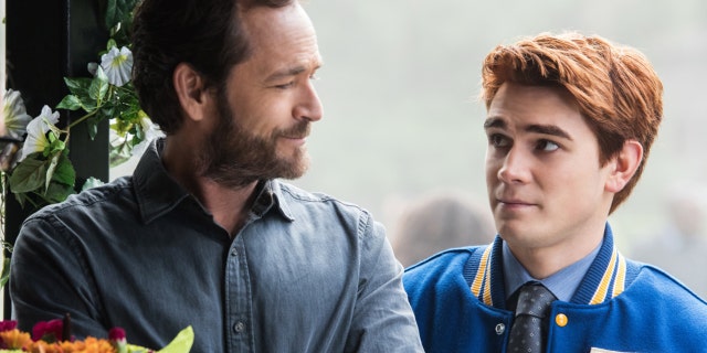 Luke Perry, left, pictured here as Fred Andrews, with his on-screen son, Archie Andrews, right, portrayed by KJ Apa on The CW's "Riverdale."