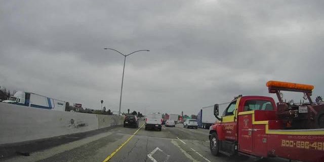 About $500 was thrown in the lanes of Interstate 880 on Monday by family members on the way back from a funeral.