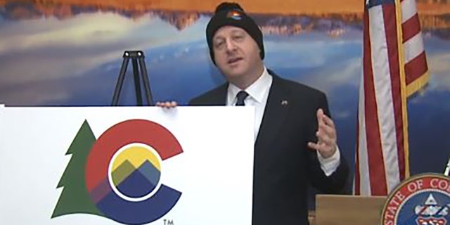 Colorado Gov. Jared Polis unveils the state's new logo Tuesday. (FOX 31 Denver)