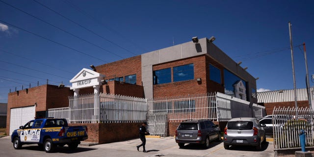 A police officer walks outside the morgue where an autopsy is being performed on the body of English tourist Catherine Shaw in Quetzaltenango, Guatemala, Tuesday, March 12, 2019.