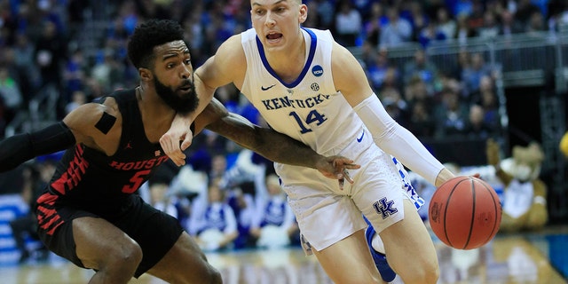 Kentucky's Tyler Herro (14) drives past Houston's Corey Davis Jr. (Associated Press)