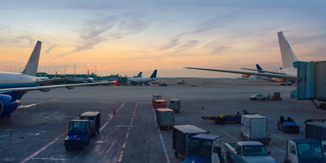 A naked passenger was reportedly detained after walking onto the tarmac at Chicago O'Hare International Airport.