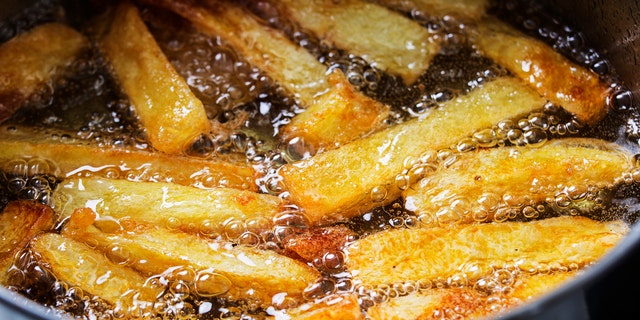 French fries are typically deep-fried in hot bubbling oil.