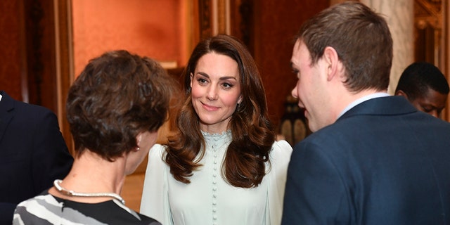Kate Middleton stunned in a mint-green ruffled dress. (AP)
