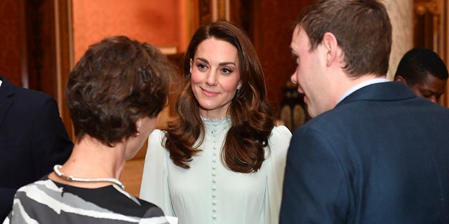 Kate Middleton stunned in a mint-green ruffled dress. (AP)