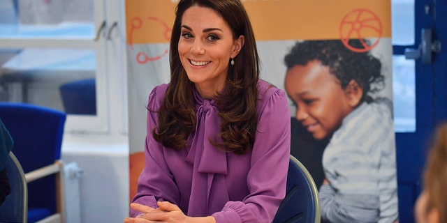 Britain's Kate the Duchess of Cambridge sits, during a visit to the Henry Fawcett Children's Centre in Kennington, London, Tuesday, March 12, 2019.