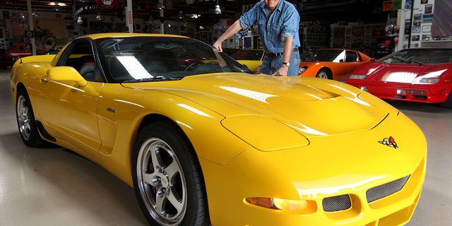 Jay Leno stands next to a Corvette Z06 at Jay's garage in Burbank. 