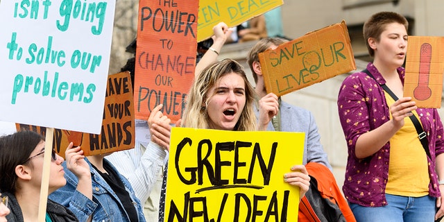 NEW YORK, NY, UNITED STATES - Protesters saw signs during the climate strike at Columbia University in New York, NY. (Photo by Michael Brochstein / SOPA Images / LightRocket via Getty Images)