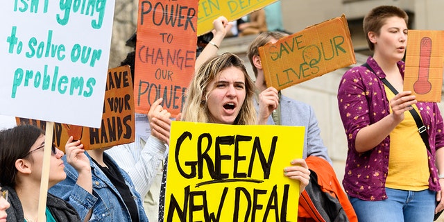 NEW YORK, NY, UNITED STATES - Protesters saw signs during the climate strike at Columbia University in New York, NY. (Photo by Michael Brochstein / SOPA Images / LightRocket via Getty Images)