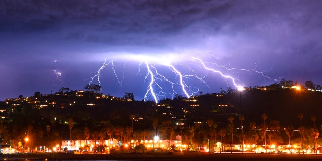 This time exposure photo provided by the Santa Barbara County Fire Department shows a series of lightning strikes over Santa Barbara, Calif., seen from Stearns Wharf in the city's harbor, Tuesday evening, March 5, 2019.