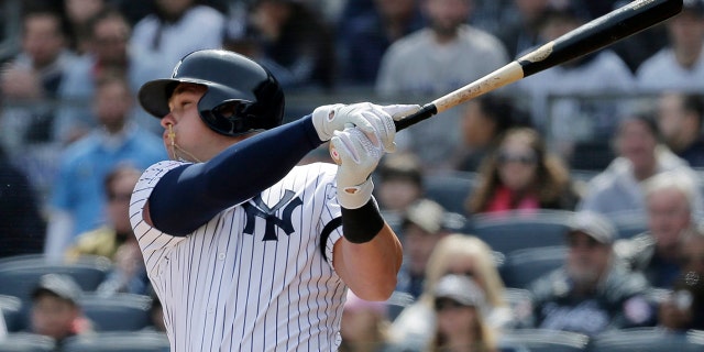 New York Yankees' Luke Voit hits a three-run homer during the first inning of an Opening Day baseball game Thursday against the Baltimore Orioles at Yankee Stadium in New York. (Associated Press)