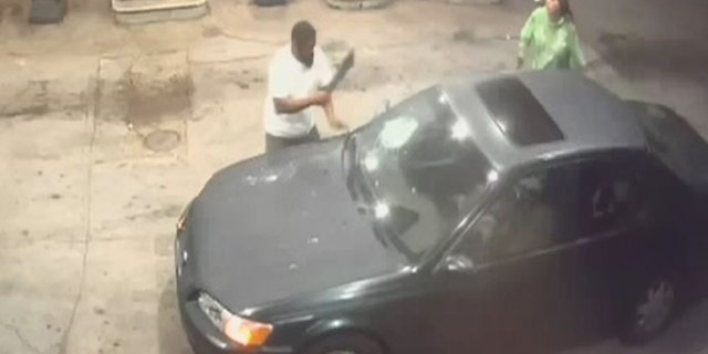 The clerk and a second suspect fight outside the store, where the clerk bashed their getaway car so that police could recognize it.