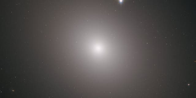 The Hubble Space Telescope captured this image of a galaxy called Messier 49, which contains about 200 billion stars.