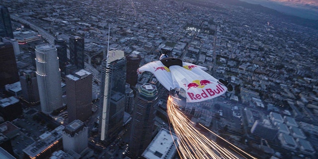 Jon Devore wingsuit flys past the Supermoon in Los Angeles, California, USA on 20 March, 2019.
