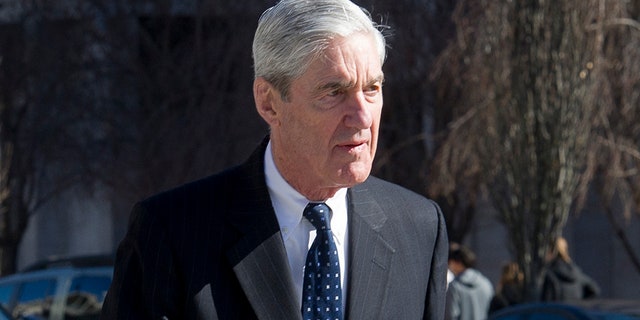 Special advocate Robert Mueller travels to his car after attending religious services at the St. John's Episcopal Church, across from the White House in Washington on Sunday.